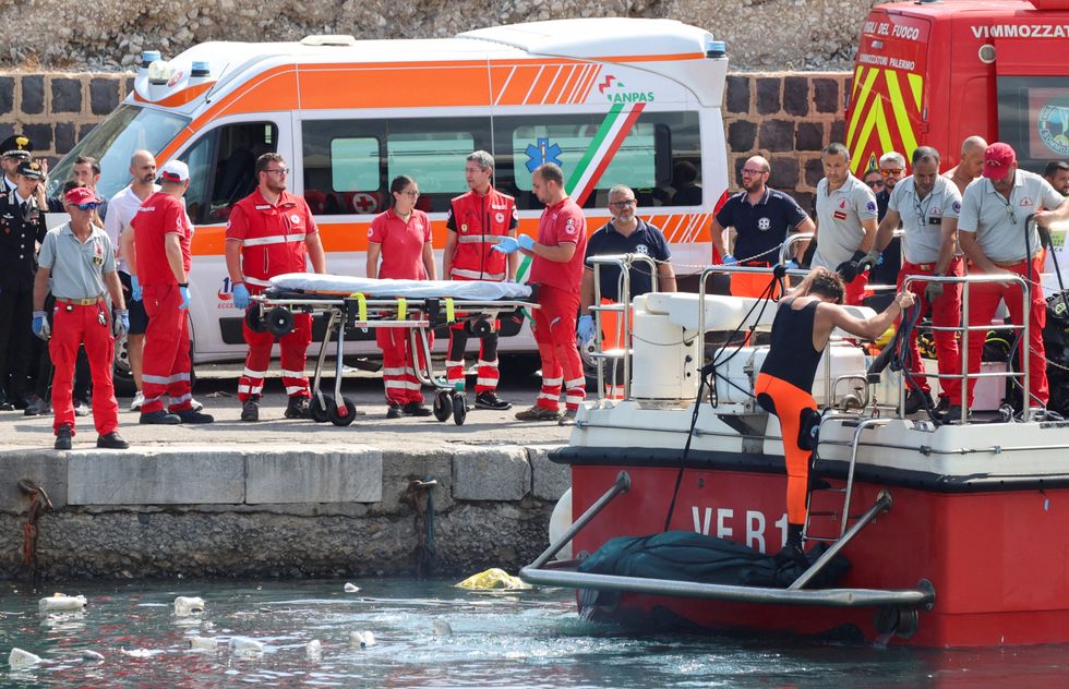 Medical teams bringing a body to shore