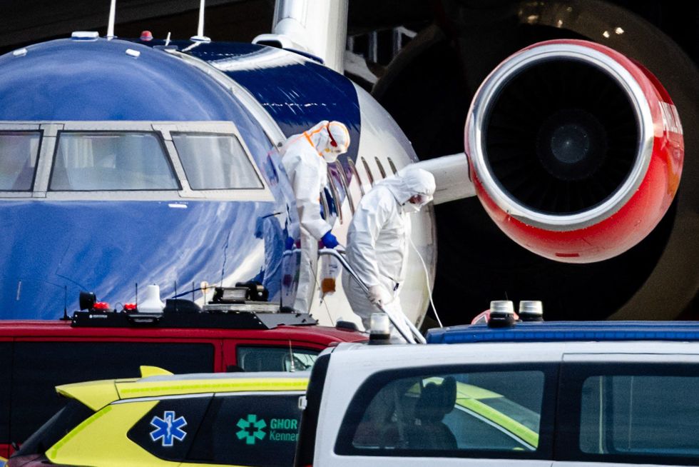 MEDICS IN HAZMAT SUITS