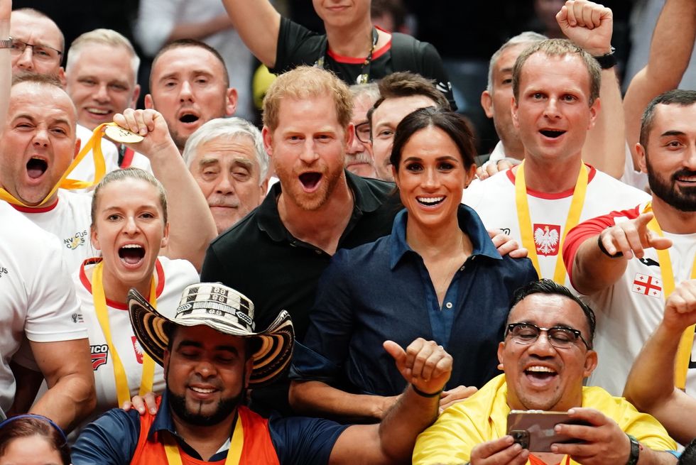Meghan and Harry celebrate with athletes
