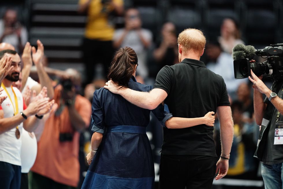 Meghan and Harry seen arm-in-arm