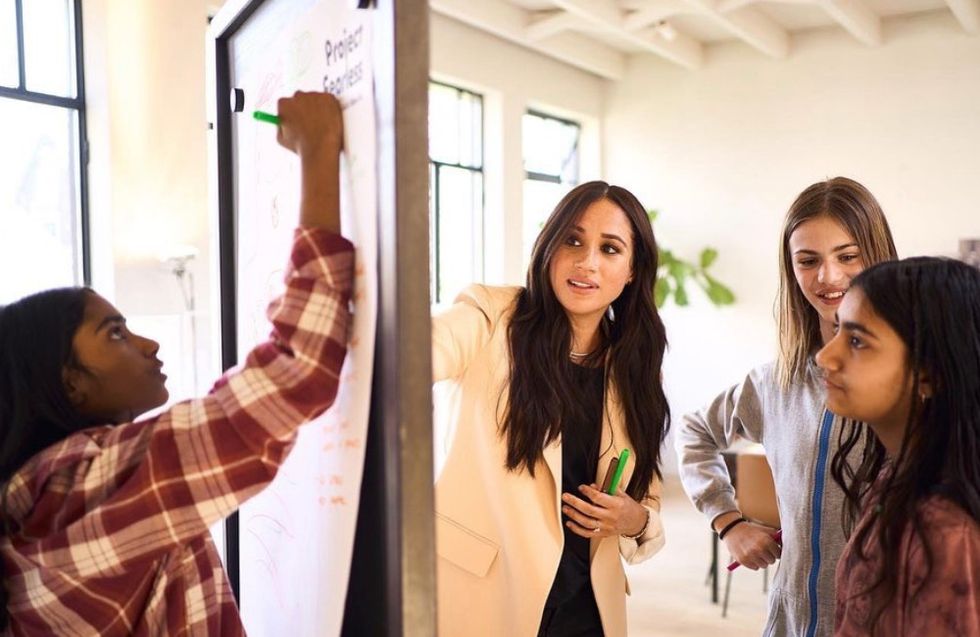 Meghan Markle accompanied children at a whiteboard during the activity