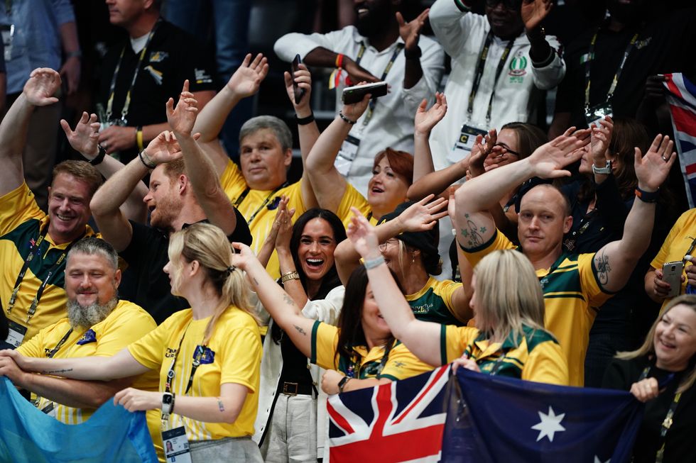 Meghan Markle seated in a sea of Australian supporters