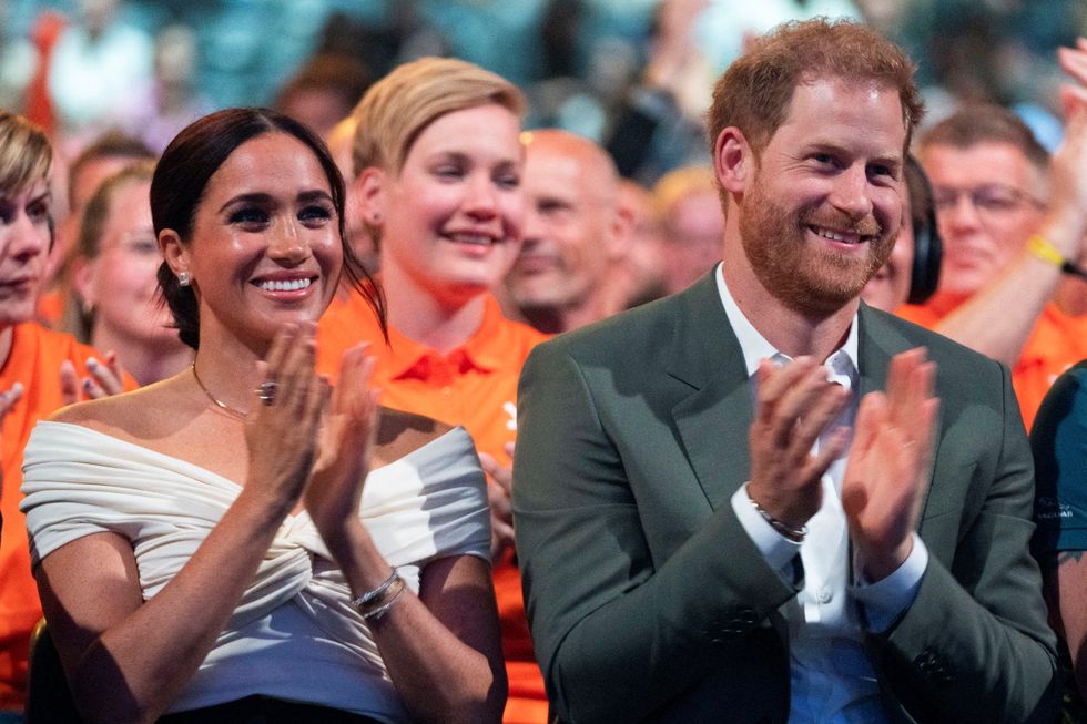 Meghan with Prince Harry at the Invictus Games earlier this year