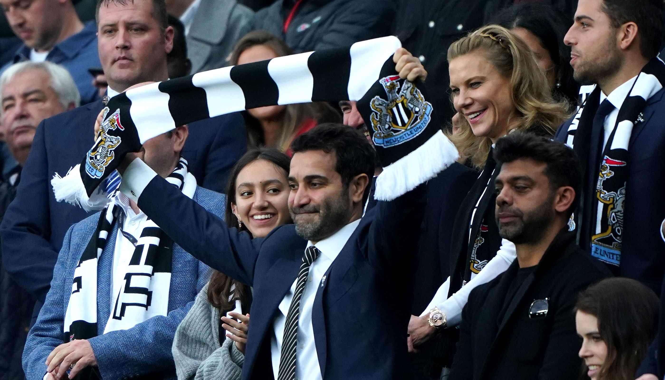 Mehrdad Ghodoussi, husband of Amanda Staveley, holds up a scarf prior to kick-off in the Premier League match at St. James' Park, Newcastle. Picture date: Sunday October 17, 2021.