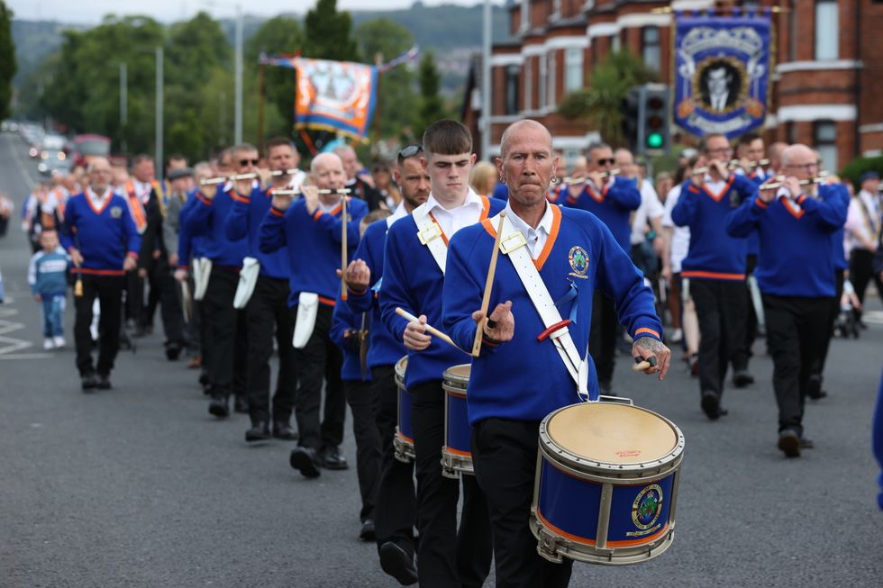 Members of a Protestant loyalist order, Pride of Ardoyne, take part in a Twelfth of July parade in Ardoyne, Belfast, as part of the traditional Twelfth commemorations marking the anniversary of the Protestant King William's victory over the Catholic King James at the Battle of the Boyne in 1690. Picture date: Tuesday July 12, 2022.