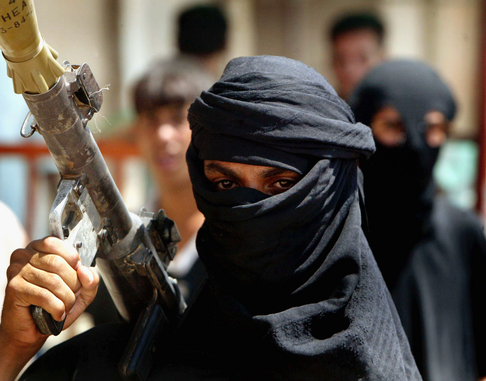 Members of Al-Mehdi army who are loyal to Shiite cleric Moqtada Al-Sadr, brandish their weapons as they prepare for a possible battle with US troops August 5, 2004 in the Sadr City neighborhood of Baghdad, Iraq. Members of Al-Mehdi army who are loyal to Shiite cleric Moqtada Al-Sadr, brandish their weapons as they prepare for a possible battle with US troops August 5, 2004 in the Sadr City neighborhood of Baghdad, Iraq.