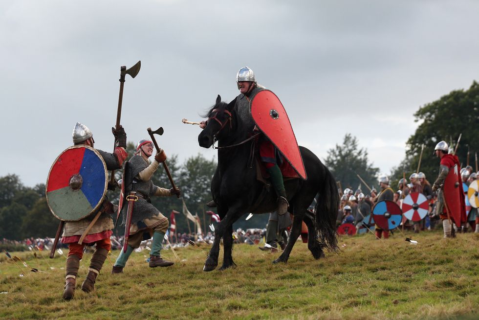 Members of historical re-enactment groups assume the role of Saxon and Norman soldiers