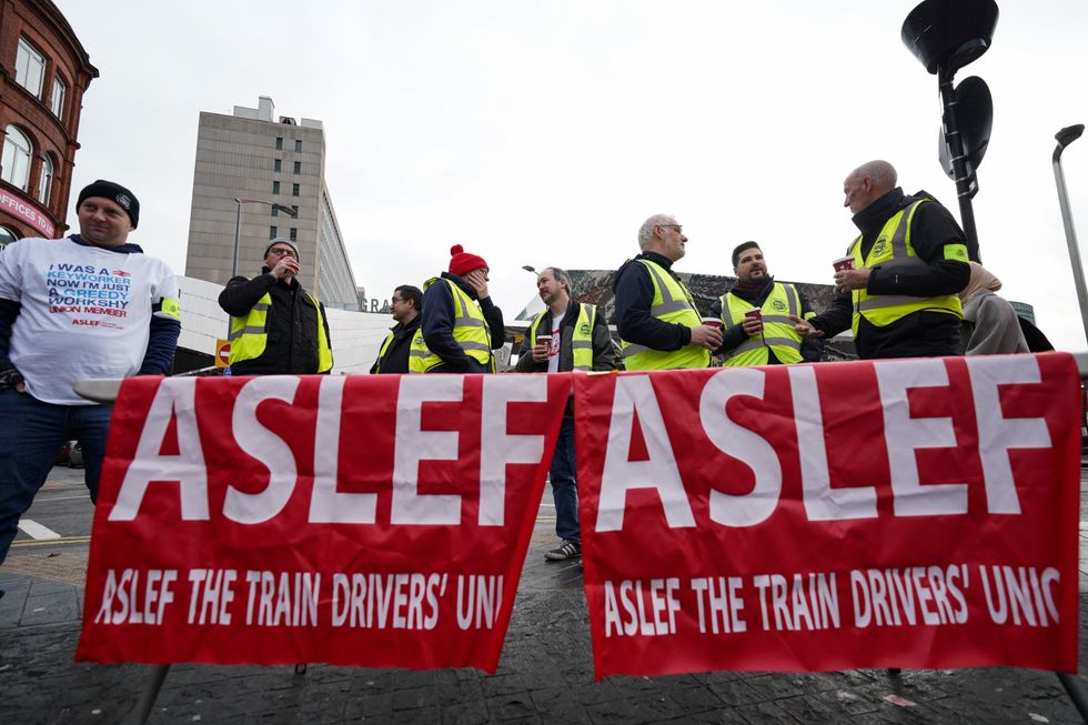 Members of the Aslef Union picket at New Street station in Birmingham, in a long-running dispute over jobs and pensions. Picture date: Thursday January 5, 2023.