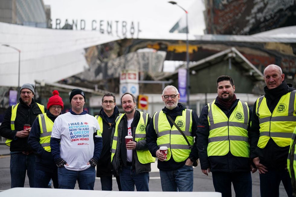 Members of the Aslef Union picket at New Street station in Birmingham, in a long-running dispute over jobs and pensions. Picture date: Thursday January 5, 2023.