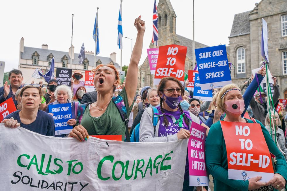 Members of the campaign group For Women Scotland demonstrate outside the Scottish Parliament at Holyrood in Edinburgh