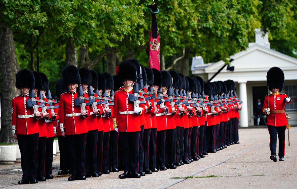 Members of the Coldstream Guards leave Wellington Barracks, central London, ahead of the ceremonial procession of the coffin of Queen Elizabeth II from Buckingham Palace to Westminster Hall, London. Picture date: Wednesday September 14, 2022.