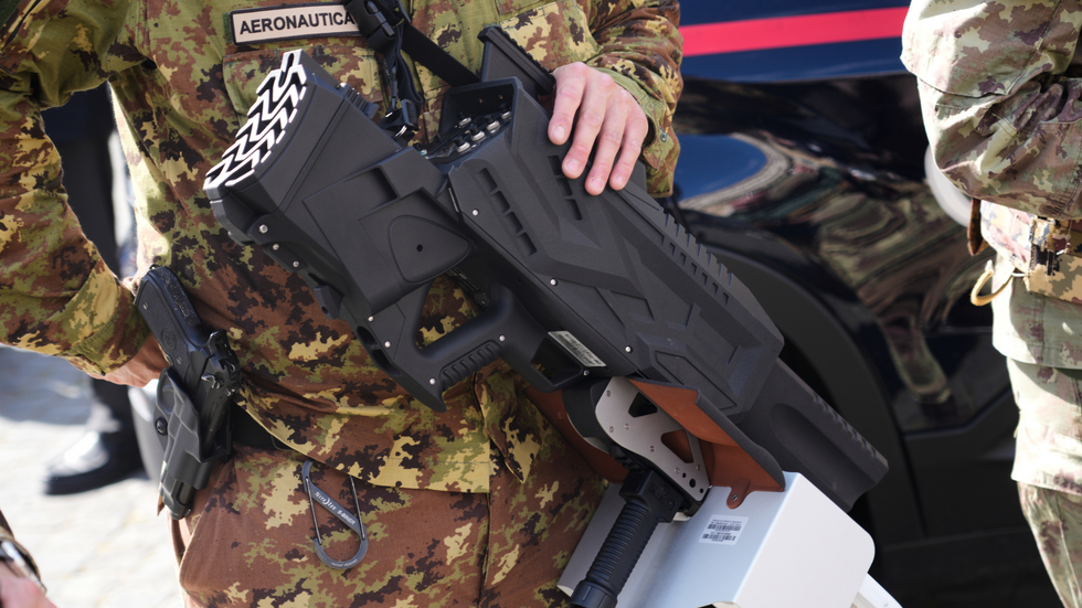 Members of the Italian armed forces are seen with an anti-drone gun at the Vatican in Rome