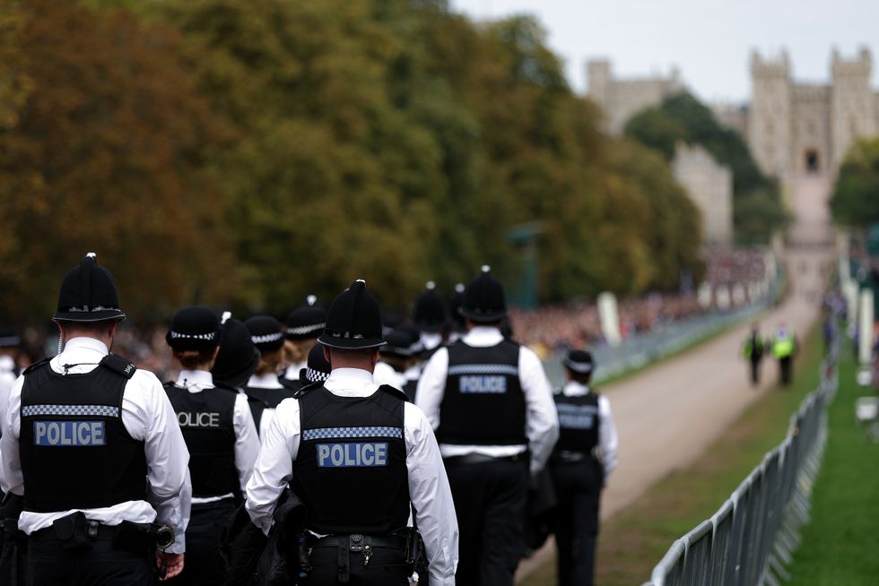 Members of the Police look on outside St George's Chapel in Windsor Castle, Berkshire. Picture date: Monday September 19, 2022.