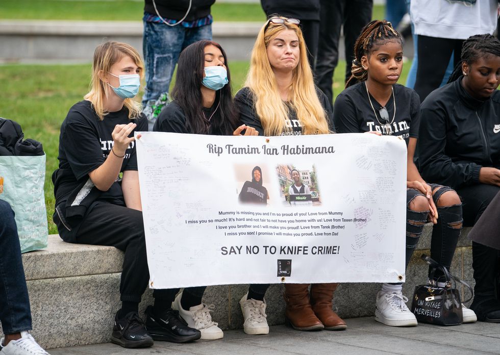 Members of the public at a vigil in General Gordon Square, Woolwich, London, to remember Tamim Ian Habimana who was stabbed to death, and to help raise awareness of knife crime.