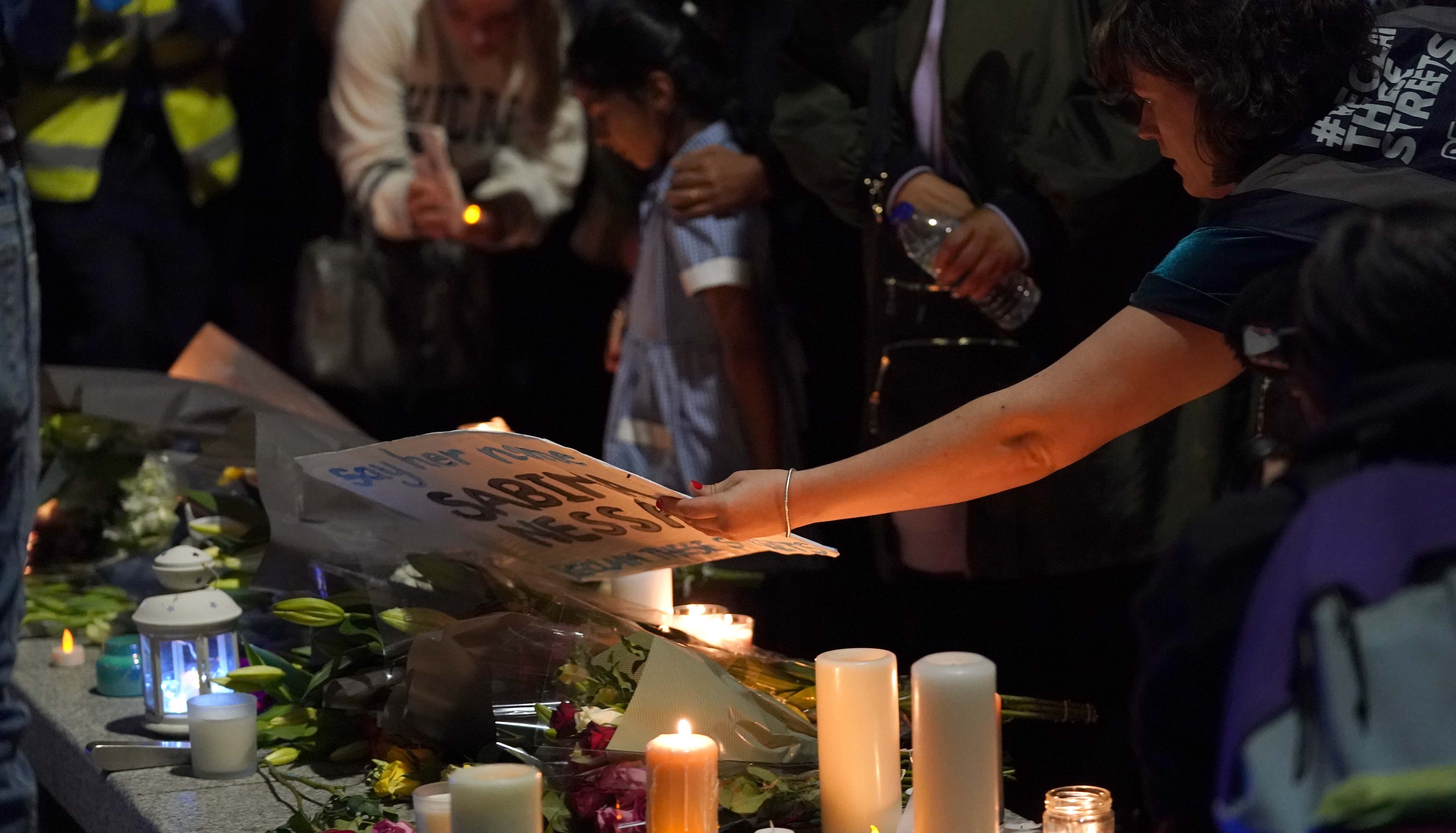 Members of the public attend a vigil in memory of Sabina Nessa, and in solidarity against violence against women, at Pegler Square in Kidbrooke, south London.