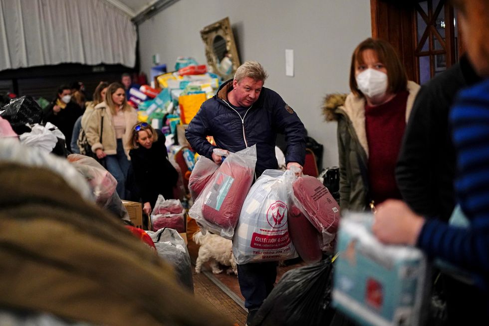 Members of the public drop off donations of aid for Ukrainian refugees at the Klub Orla Bialego (White Eagle Club) in Balham, south London, where it will be sorted before delivery overseas to those fleeing Ukraine following the Russian invasion.
