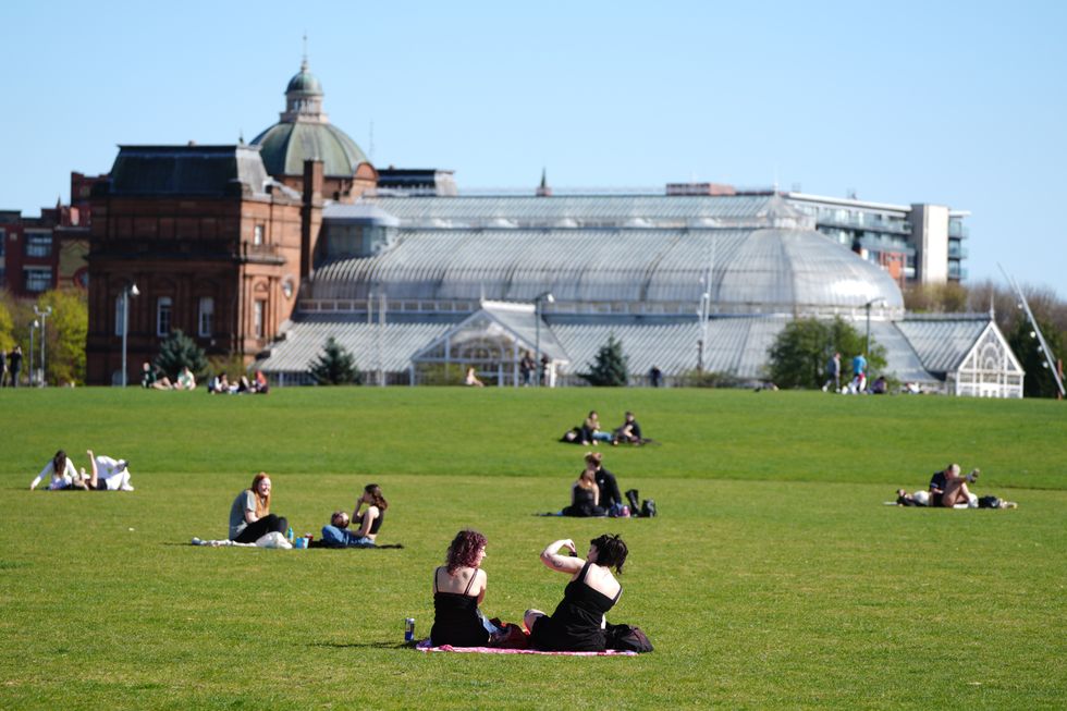 Members of the public enjoy the warm weather at Glasgow Green