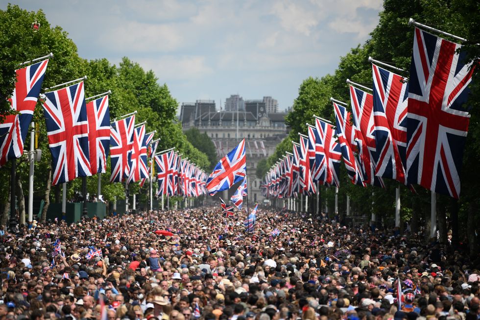 Members of the public fill the Mall before a flypast during the Trooping the Colour ceremony at Horse Guards Parade, central London, as the Queen celebrates her official birthday, on day one of the Platinum Jubilee celebrations. Picture date: Thursday June 2, 2022.
