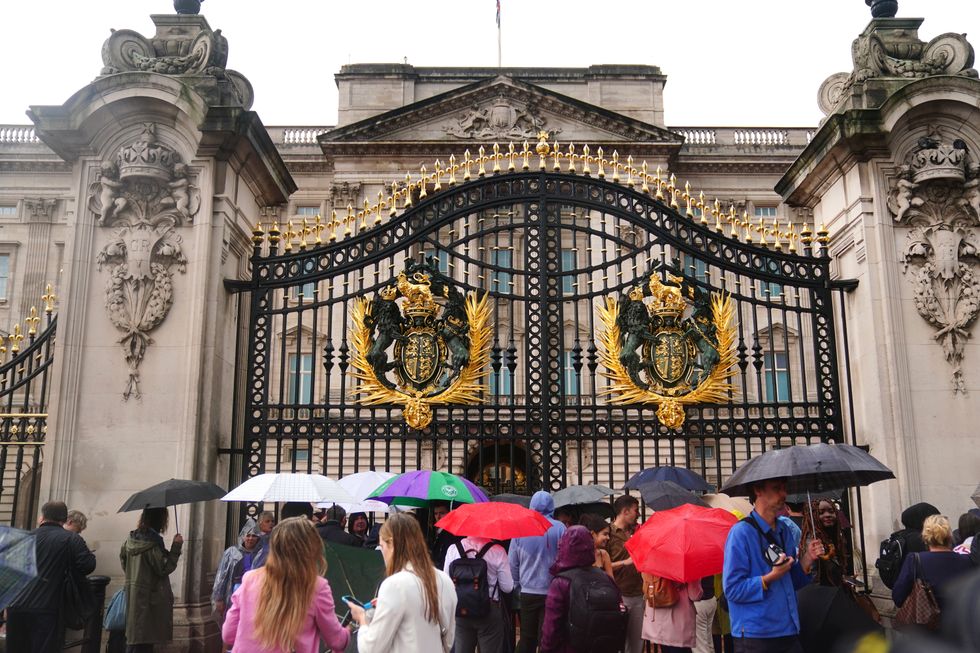 Members of the public gather outside Buckingham Palace in central London. Queen Elizabeth II is under medical supervision with the royal family rushing to be by her side amid serious health fears. Buckingham Palace has issued a statement saying royal doctors were concerned for the Queen's health, as the Prince of Wales and her other children, and the Duke of Cambridge cleared their diaries and immediately headed to her home in the Scottish Highlands. Picture date: Thursday September 8, 2022.