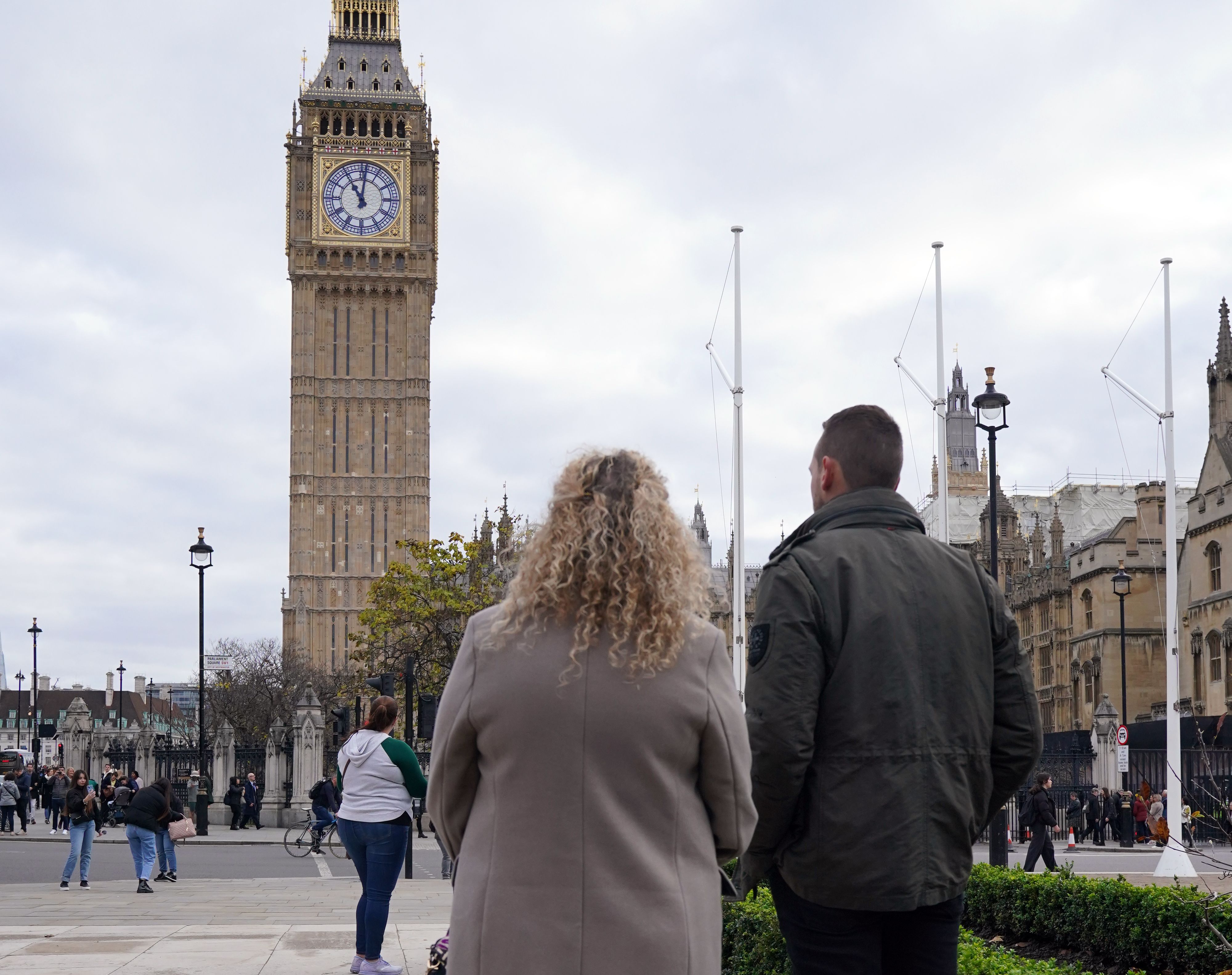 Members of the public observe a two-minutes silence in Westminster.