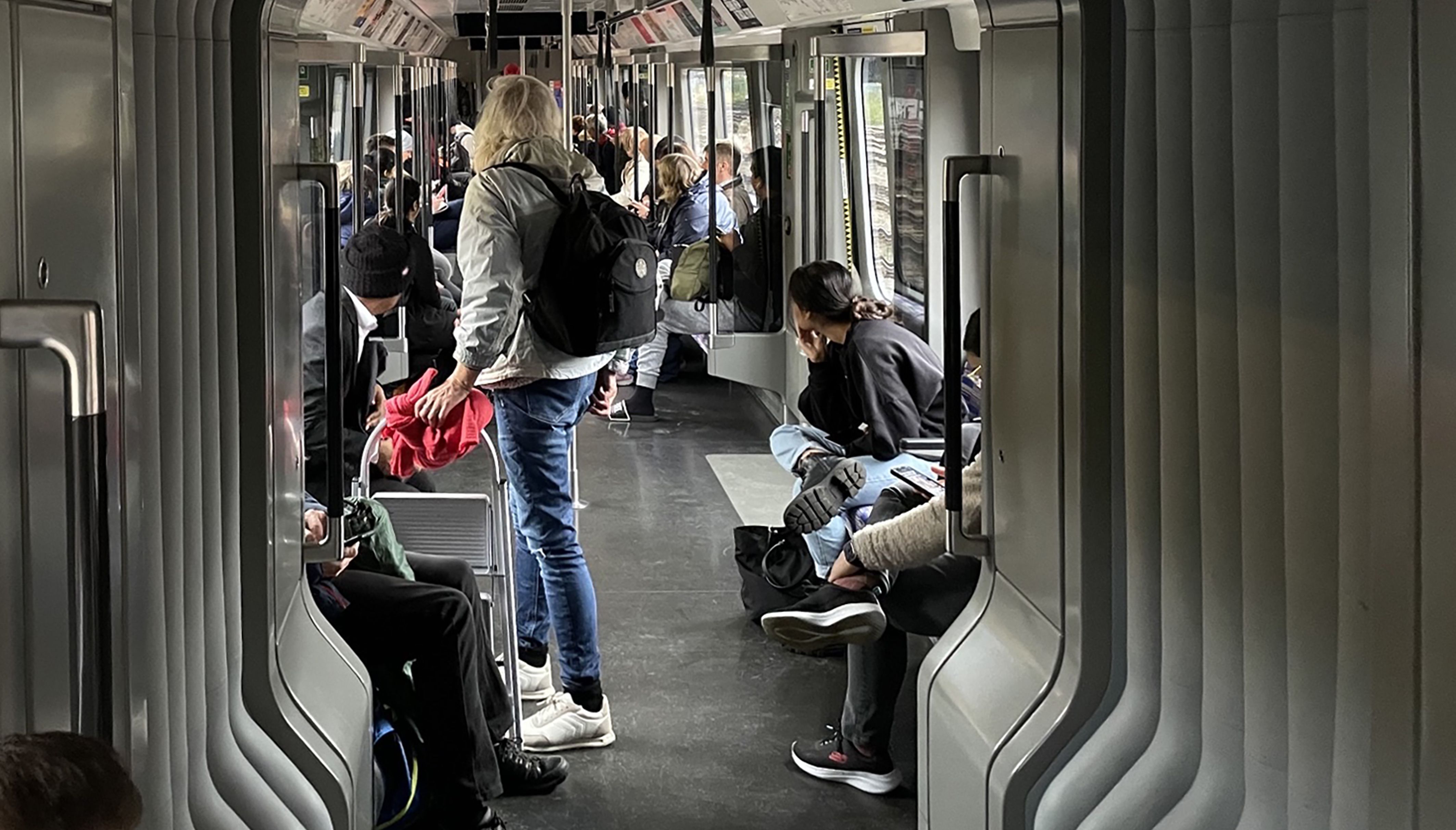 Members of the public on a Elizabeth Line train at standstill outside Royal Oak station in London, as all railway lines between Slough and Paddington are blocked due to damage to overhead electric wires, Great Western Railway said.