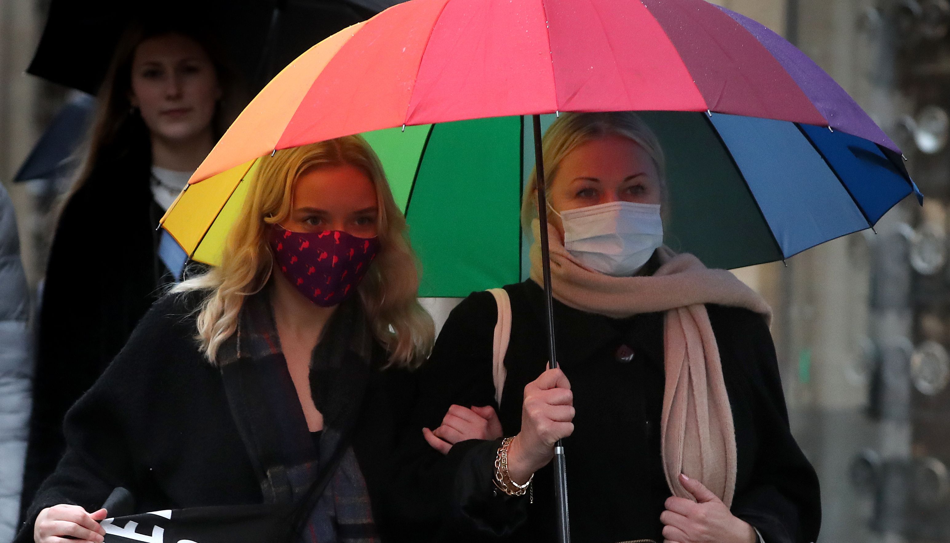 Members of the public wearing face masks. Sturgeon said the wider legal requirements for areas like shops and public transport will be converted to guidance on April 18.