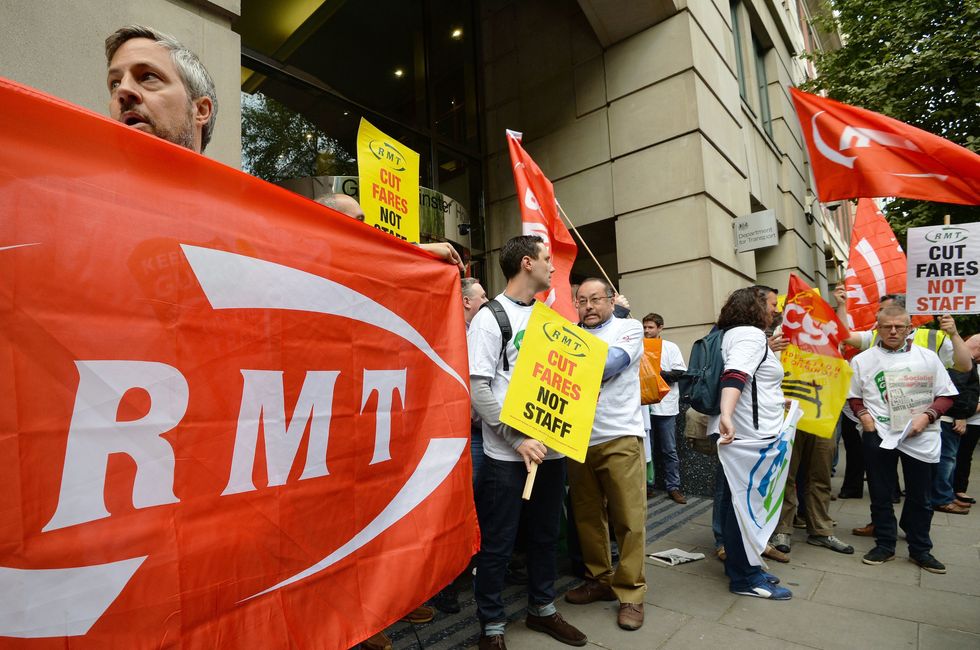 Members of the RMT union demonstrate outside the Department of Transport in Westminster