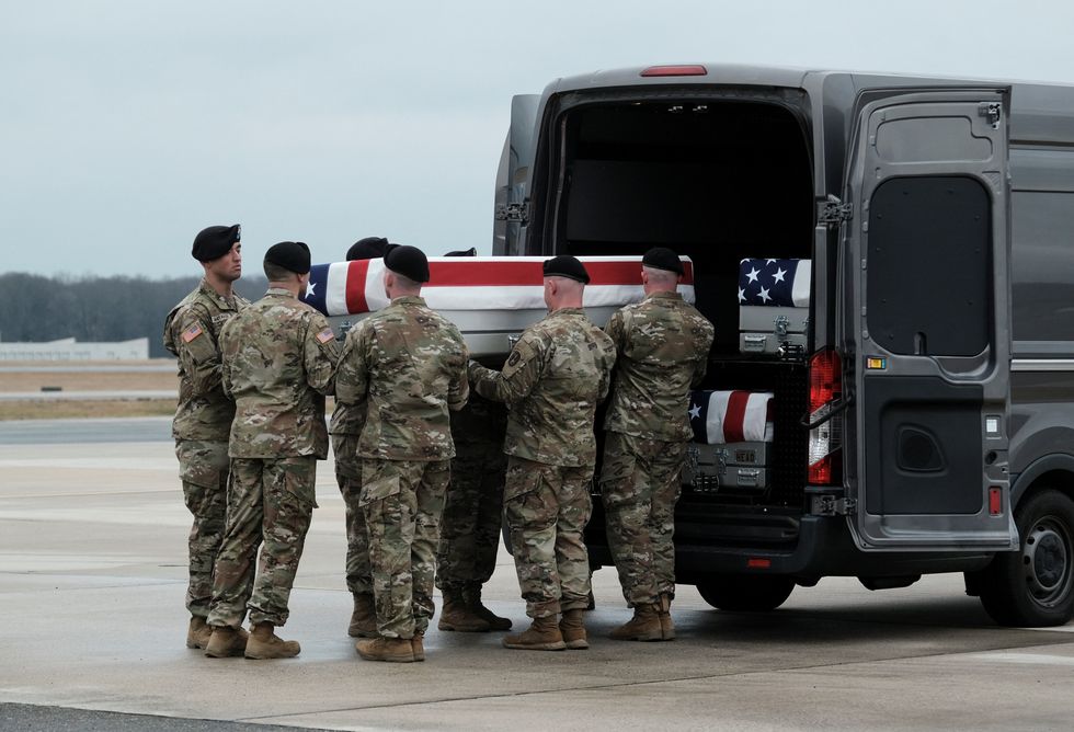 Members of the US Honor Guard carry the remains of Army Reserve Sergeants William Rivers, Kennedy Sanders and Breonna Moffett
