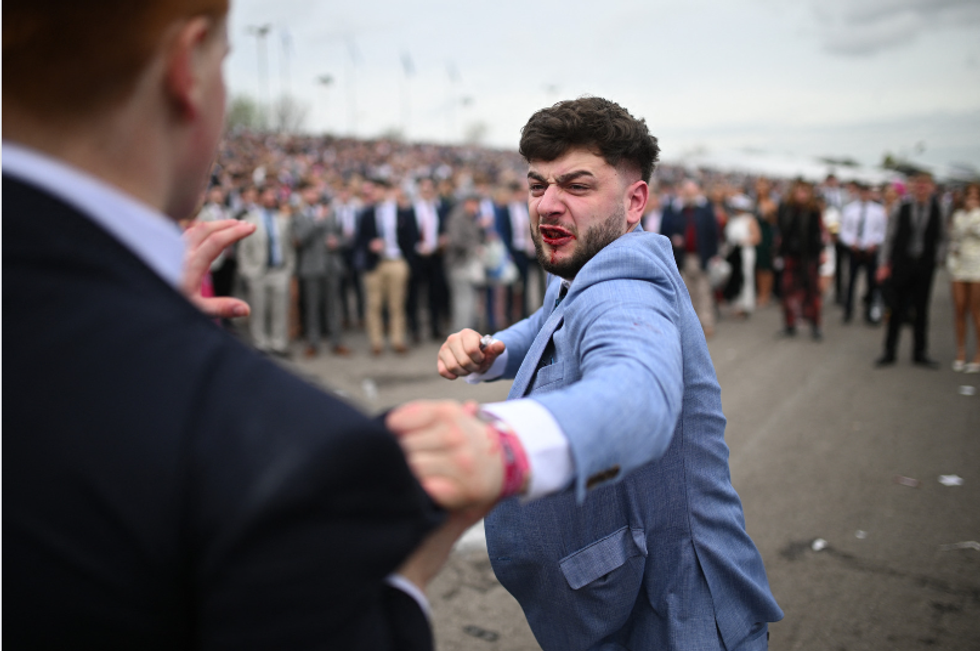 Men fighting on Ladies Day at Aintree