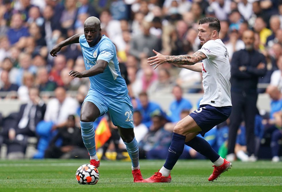 Mendy (left) and Tottenham Hotspur's Pierre-Emile Hojbjerg in action during his last game for Manchester City on August 15, 2021.