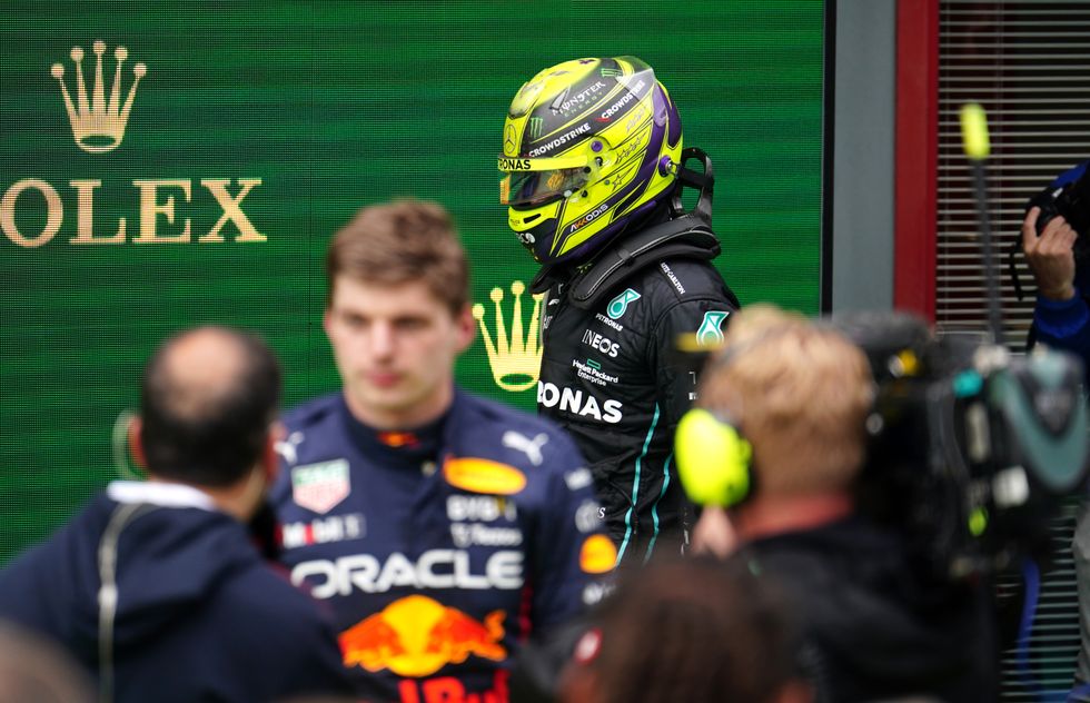 Mercedes' Lewis Hamilton walks past Red Bull Racing's Max Verstappen after the Emilia Romagna Grand Prix at the Autodromo Internazionale Enzo e Dino Ferrari circuit in Italy, better known as Imola