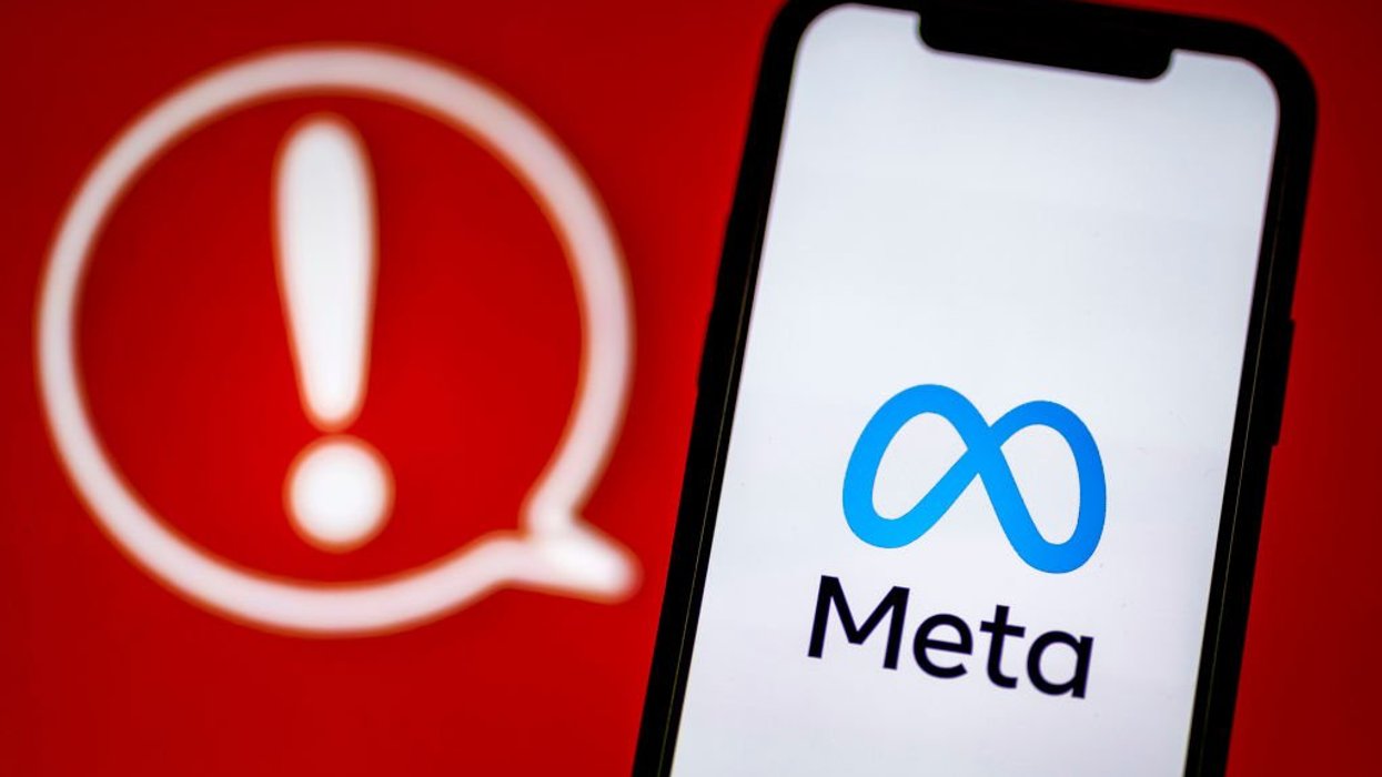 Meta logo with red exclamation point