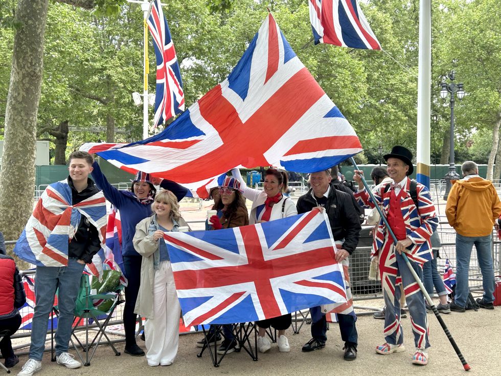 Michael Burn (right), 67, from Watford, joins the crowds at The Mall outside Buckingham Palace, ahead of a military procession marking the 80th anniversary of VE Day,\u200b