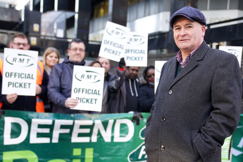 Mick Lynch, general secretary of the Rail, Maritime and Transport union (RMT), joins union members on the picket line outside Euston station in London during a rail strike in a long-running dispute over jobs and pensions. Picture date: Friday January 6, 2023.