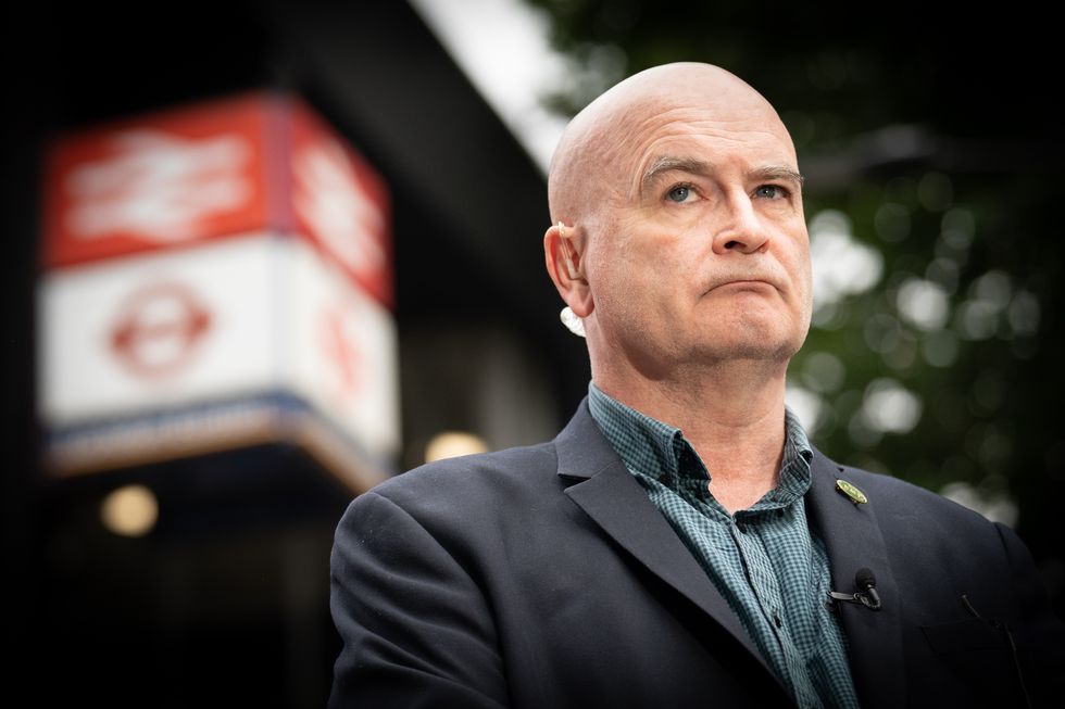 Mick Lynch, general secretary of the Rail, Maritime and Transport union (RMT) on the picket line outside London Euston train station.