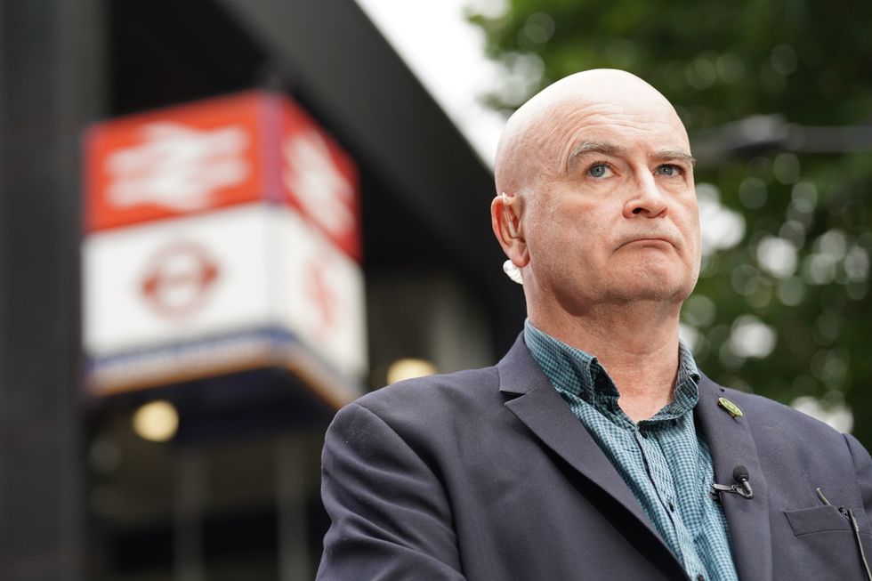 Mick Lynch, general secretary of the Rail, Maritime and Transport union (RMT) on the picket line outside London Euston train station. Picture date: Thursday August 18, 2022.