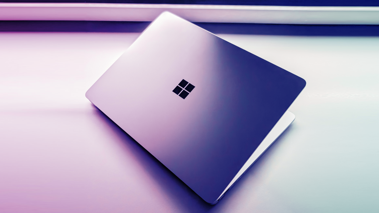 Microsoft Surface Laptop pictured lying on a desk surface