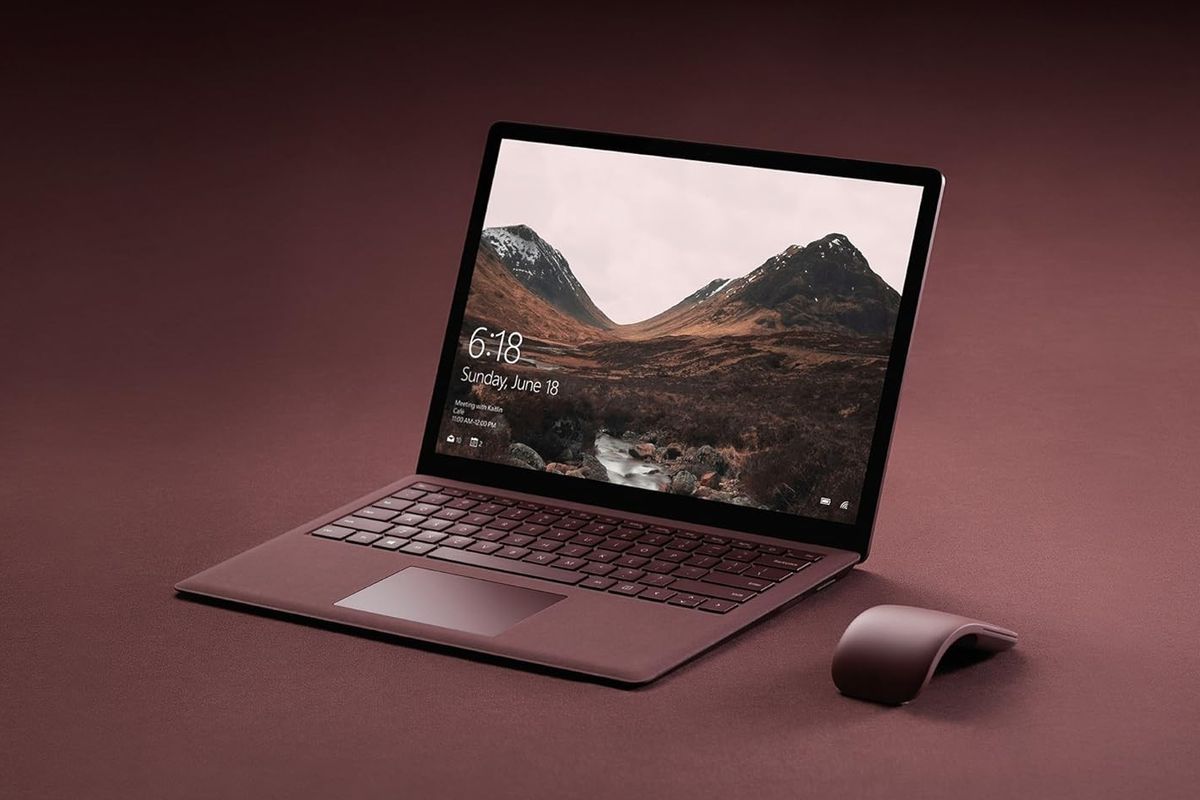 microsoft surface laptop pictured with an arc mouse