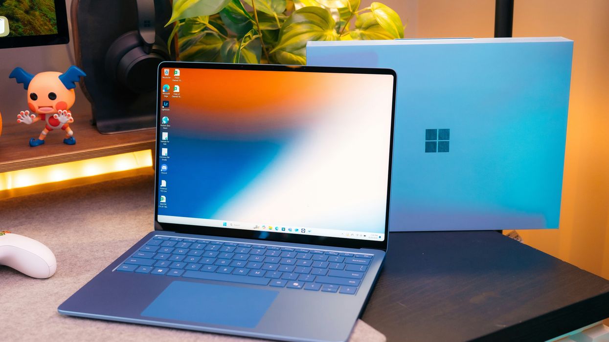 microsoft surface laptop placed on a desk with the logo clearly shown on the back of the laptop lid