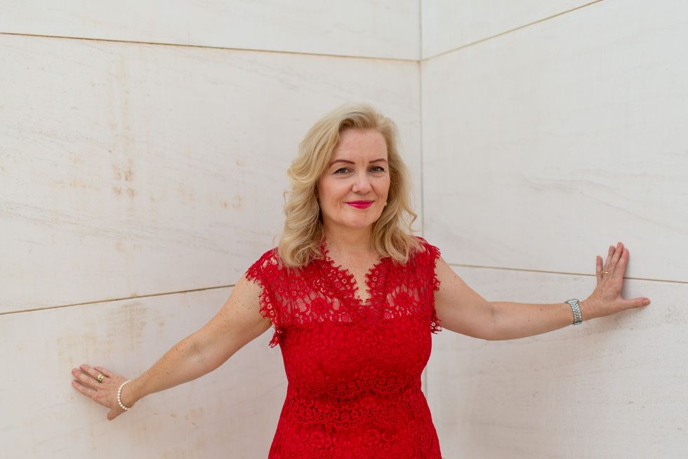 Middle-aged woman wearing red dress
