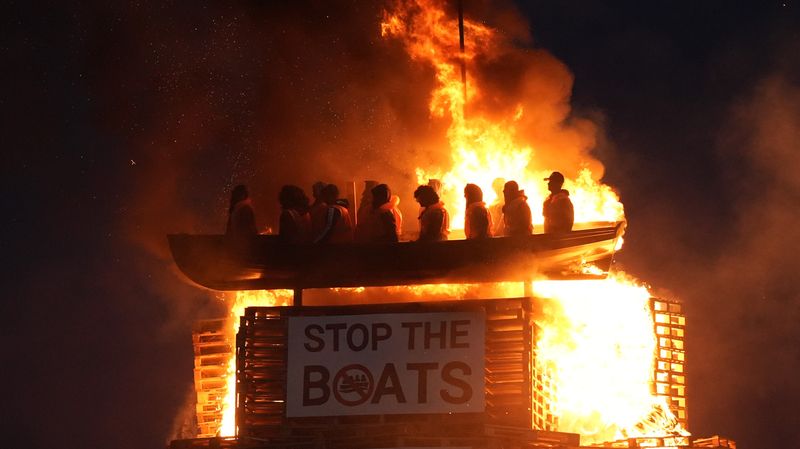 Migrant boat bonfire