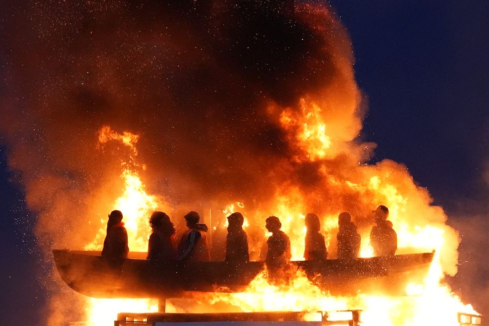 Migrant boat bonfire