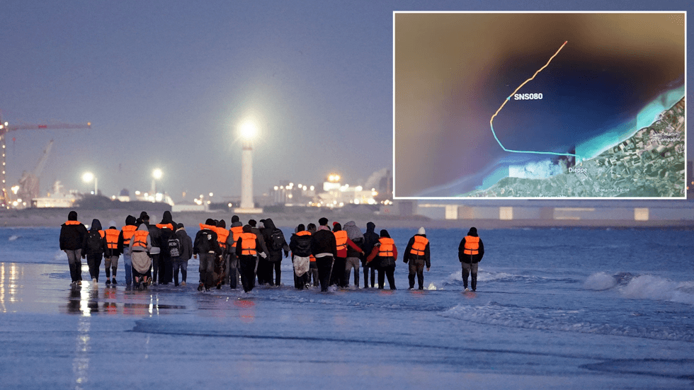 Migrants and a live map showing where the boat is