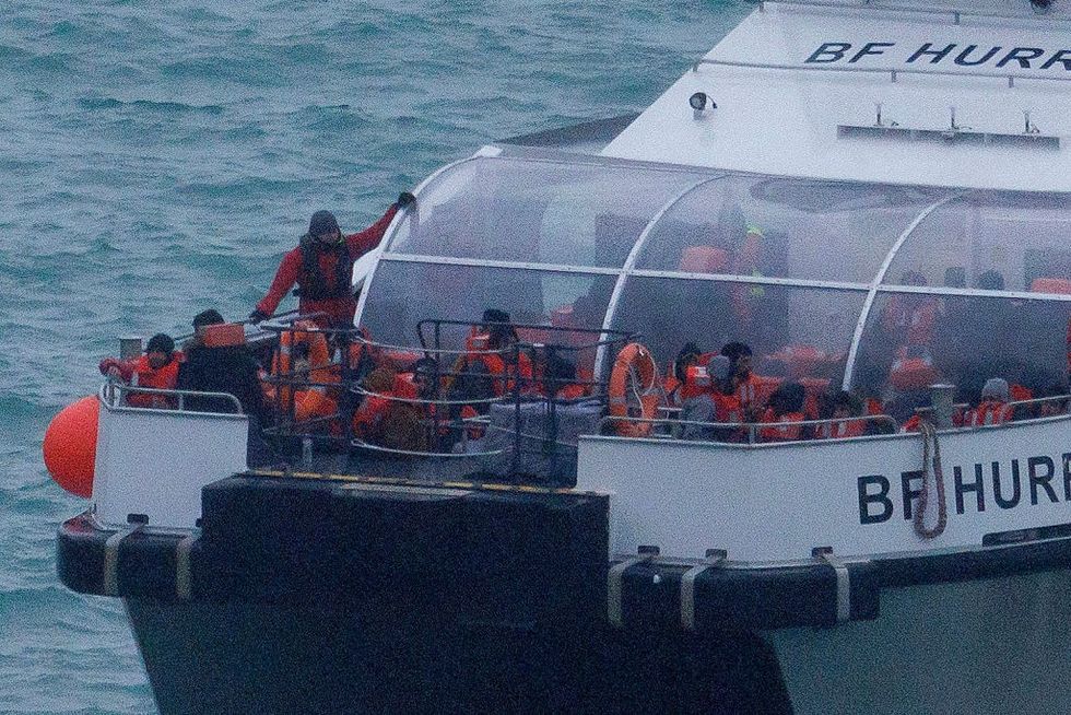 Migrants are brought ashore after being picked up in the English Channel on November 16, 2023