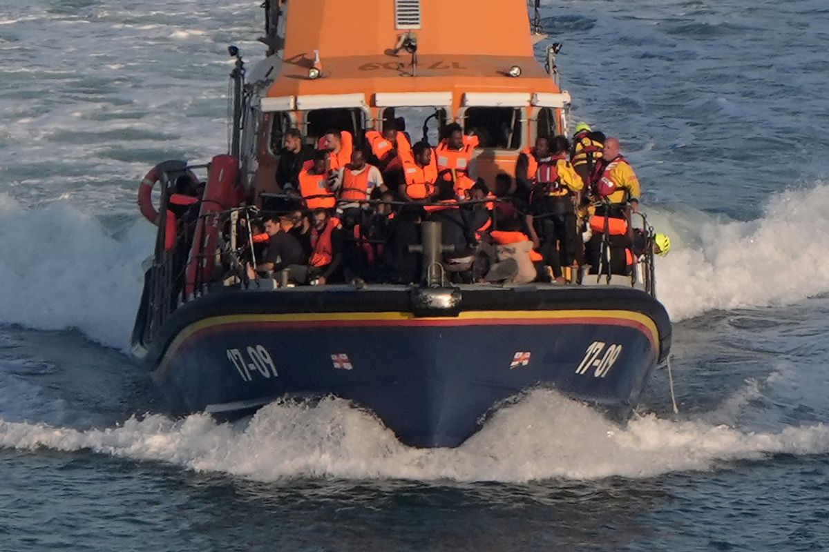 Migrants arriving on a Border Force vessel