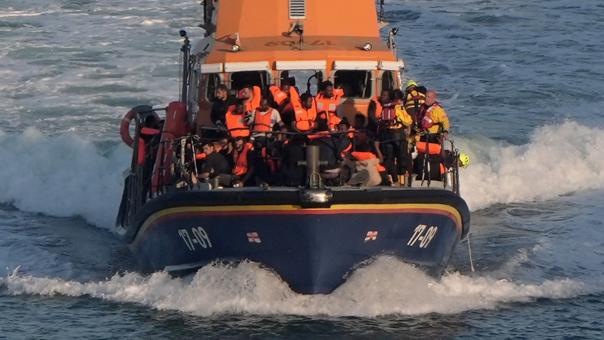 Migrants arriving on a Border Force vessel