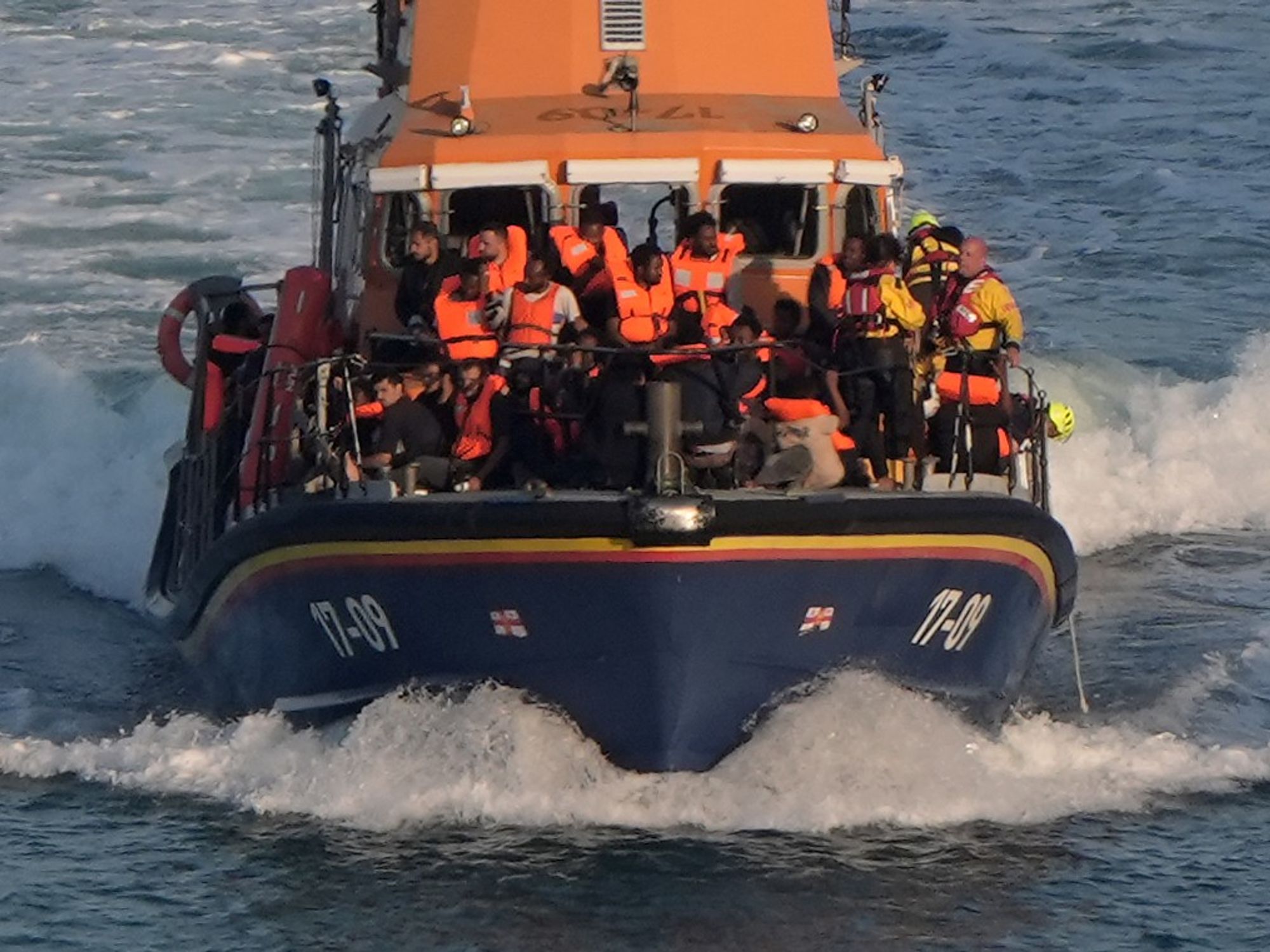 Migrants arriving on a Border Force vessel