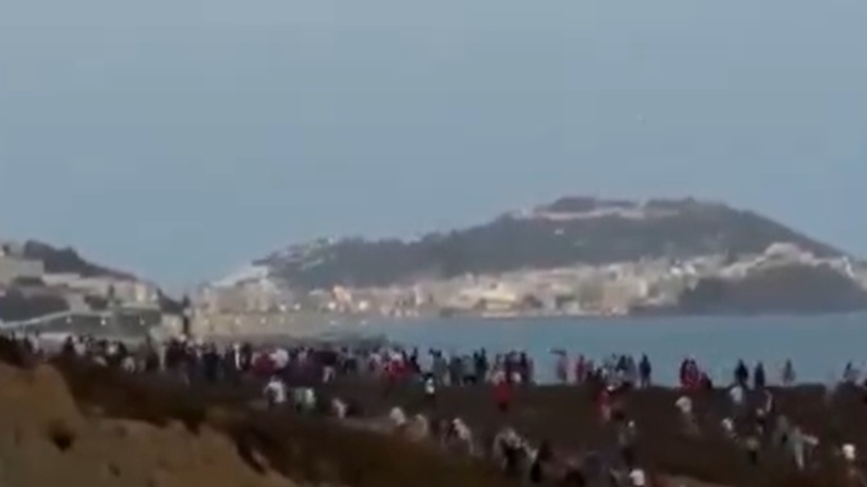 Migrants attempting to cross into the Spanish enclave on Sunday