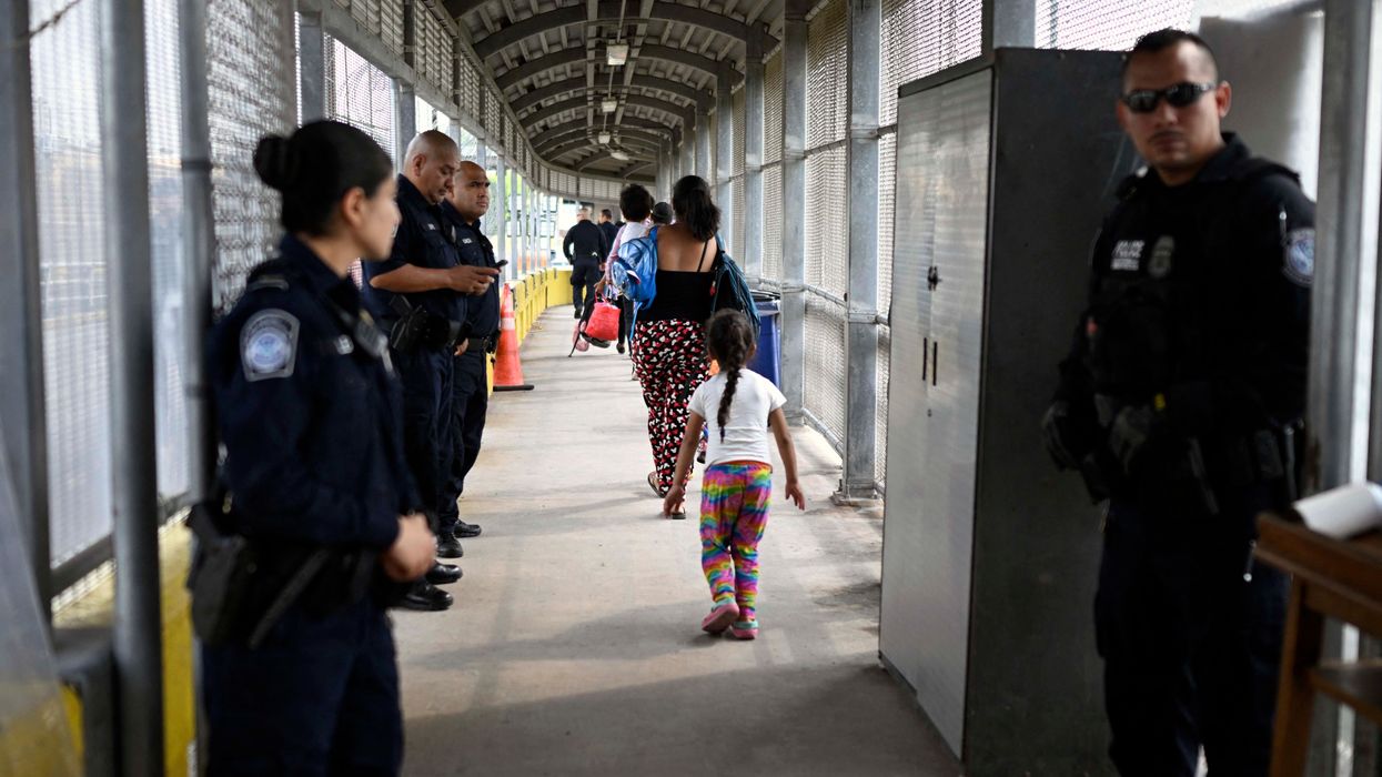 Migrants cross the Matamoros-Brownsville International Bridge