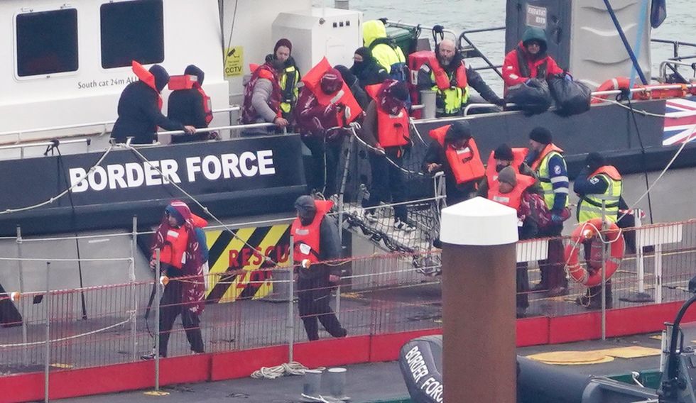 Migrants disembark from Border Force rescue vessel